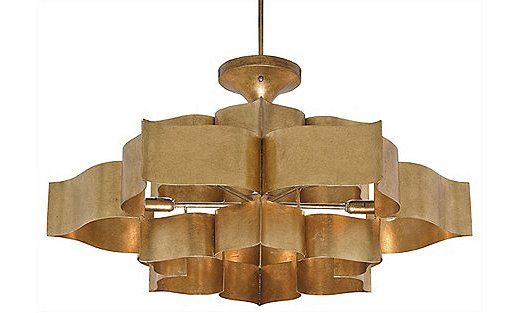 The Grand Lotus Large Chandelier in antique gold leaf; it’s also available in black.
